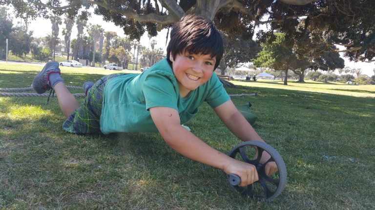 smiling kid with youth fitness team